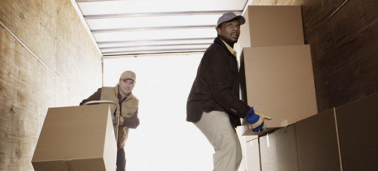 Men loading boxes onto truck