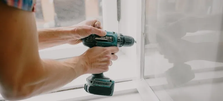 MAn doing some house maintenance